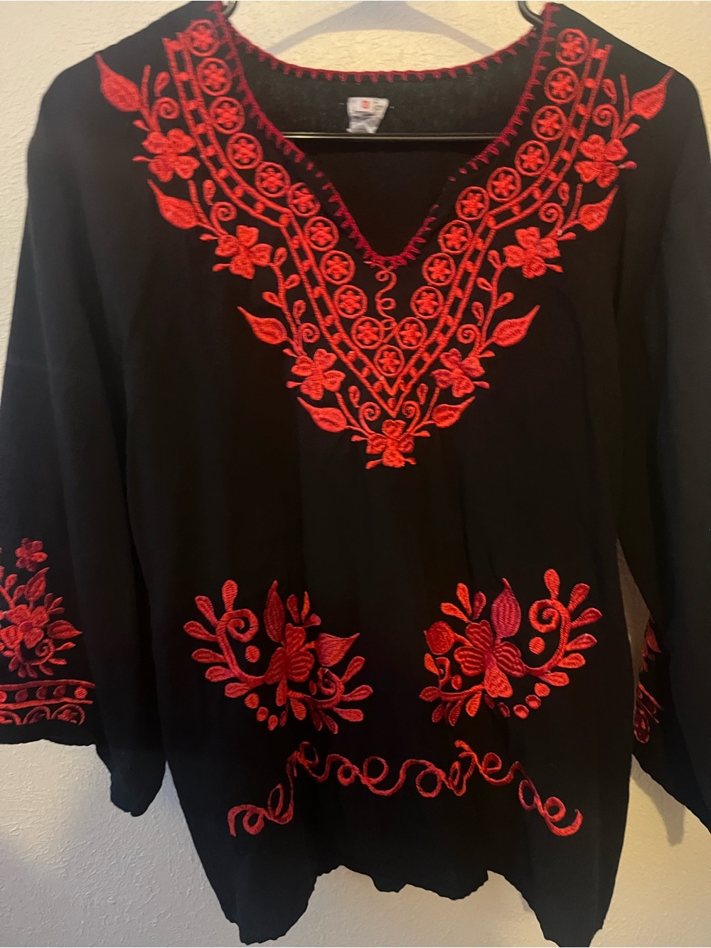 Black blouse with red flowery embroidery